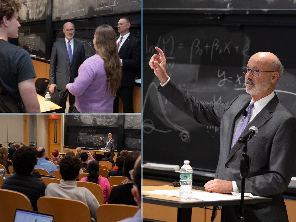 Gov. Tom Wolf of Pennsylvania stands in front of blackboard talking to a room full of students