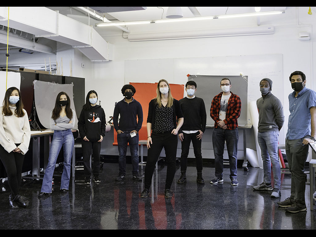 Stephanie Mueller and students socially distancing in the laboratory space to use large fabrication tools like the 3D printer. 